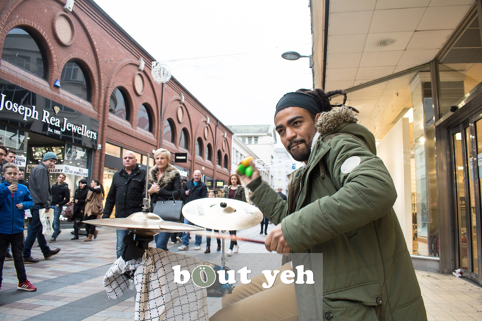Busker from Brazil drumming in Belfast city centre. Photo 3227.