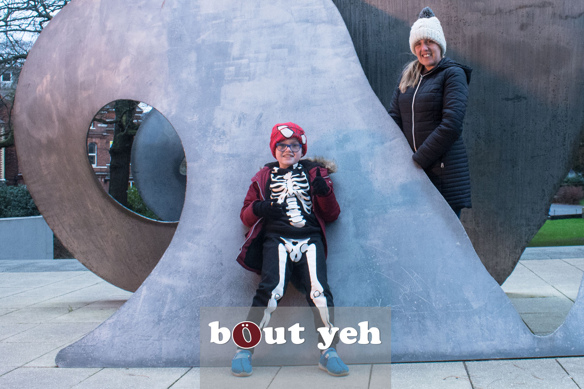 Mother and son photographed with art installation in front of Ulster Museum, Belfast - photo 4360.