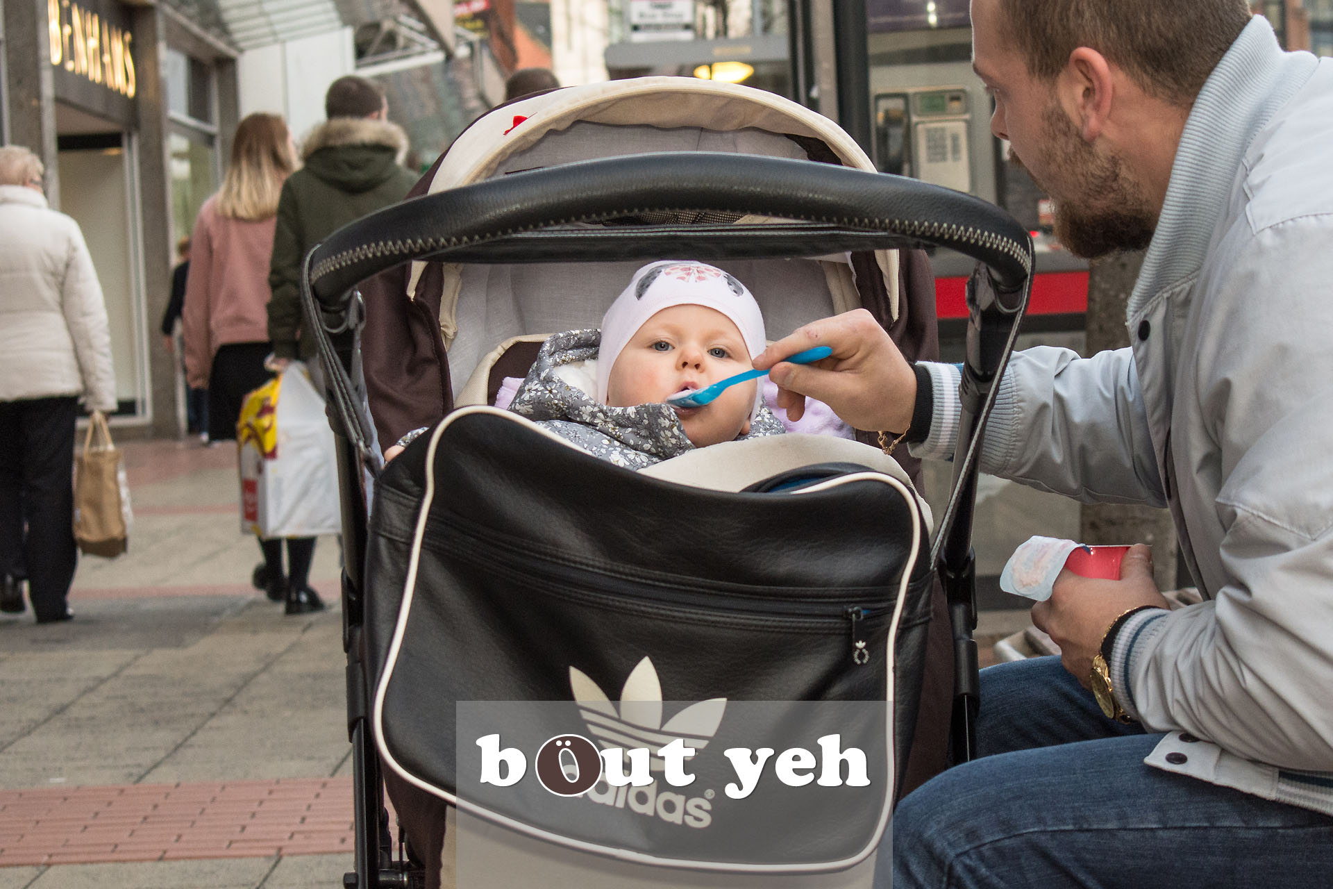 Man feeding baby, Royal Avenue, Belfast - photo 2828.