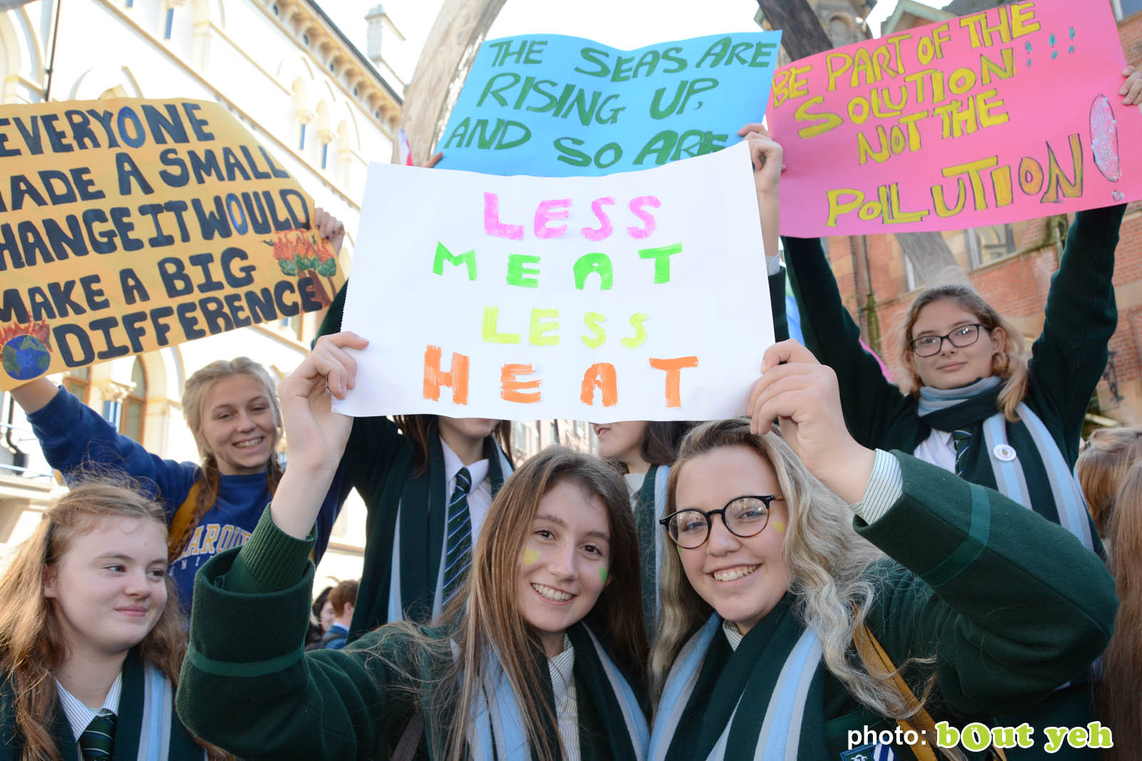 Schoolgirls holding banners at the strike for climate protest in Belfast. Photo 8931 by Bout Yeh photographers Belfast