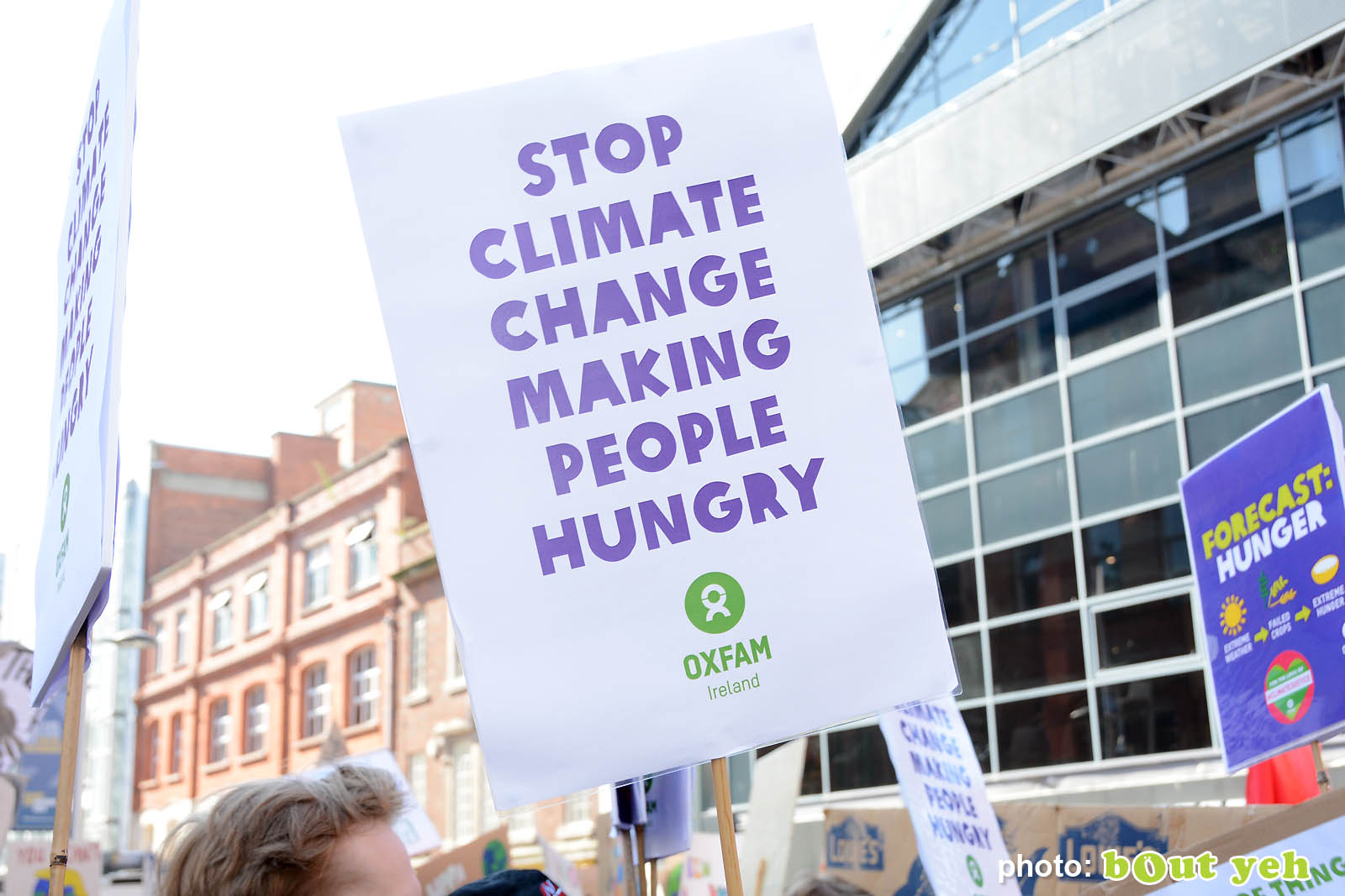 Banner with words stop climate change making people hungry at the strike for climate protest in Belfast. Photo 8937 by Bout Yeh photographers Belfast