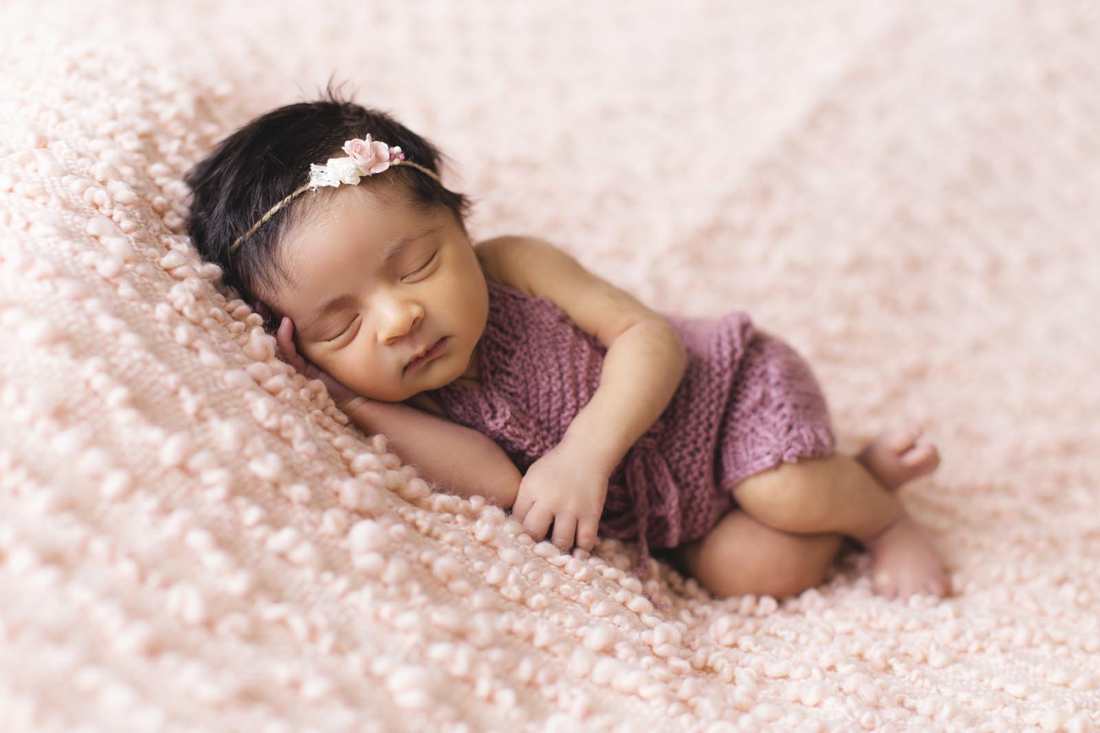 Baby photographers Belfast - baby lying in pink fleece 1442005