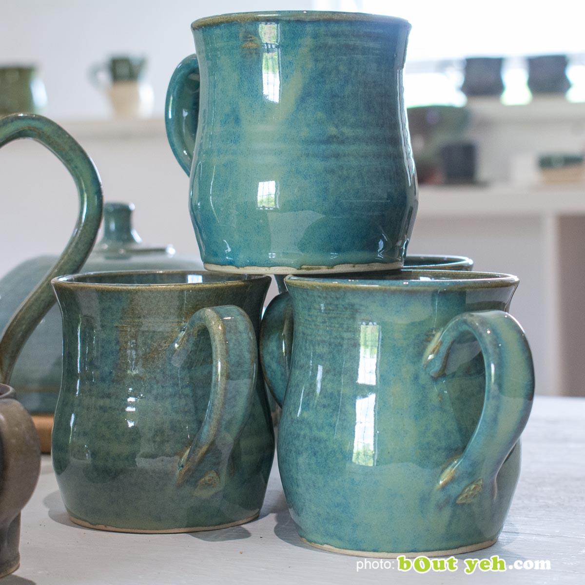 Contemporary hand made Irish pottery - tiffany blue and green curve-sided mug from Bout Yeh arts and crafts gallery Belfast and Dublin. Photo 1463