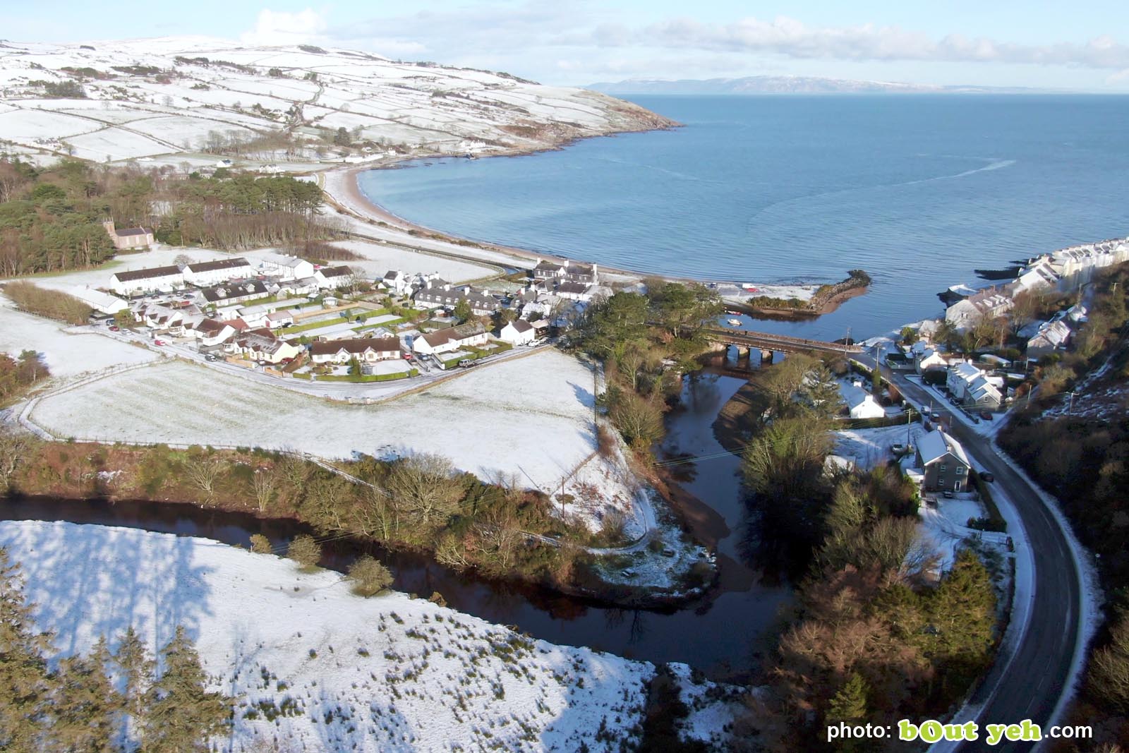 Aerial video of Cushendun under snow in winter by Bout Yeh photography and video production Belfast and Northern Ireland - video screenshot 3