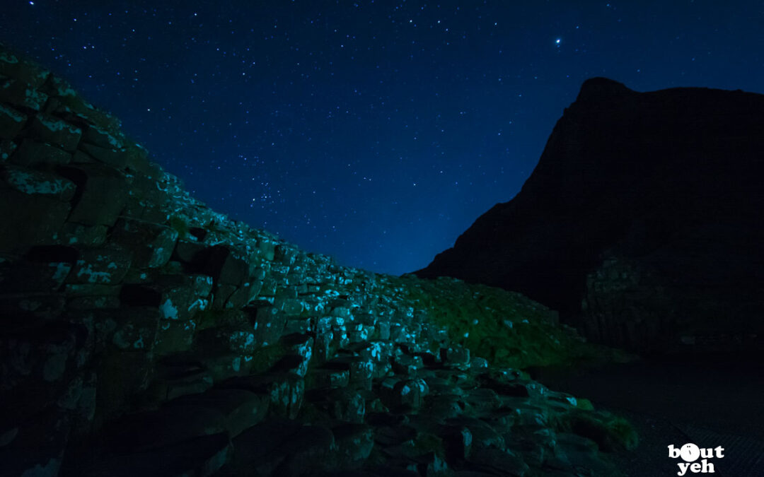 Photograph of Giants Causeway at night under stars