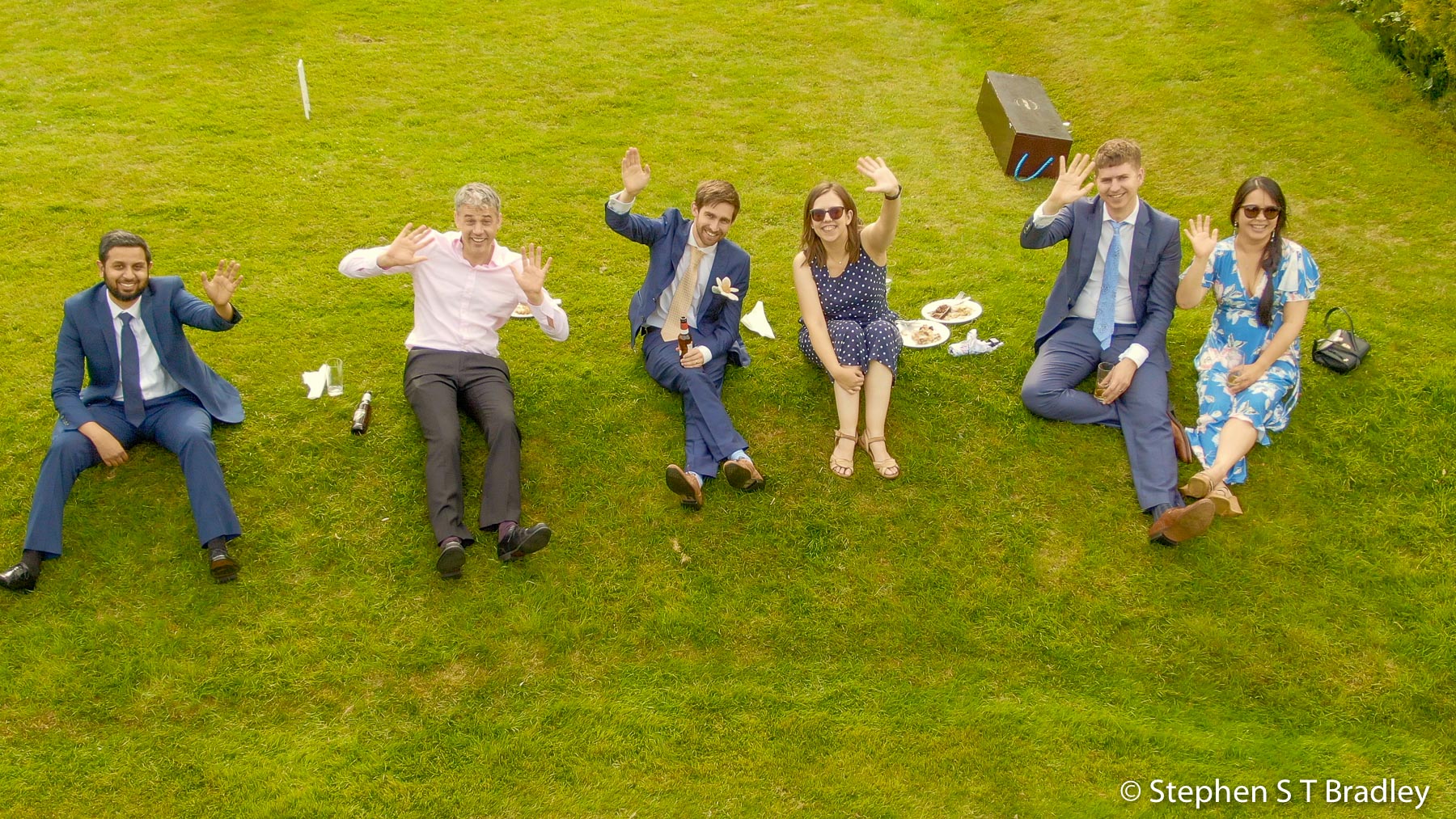 Wedding video screenshot showing wedding guests celebrating in the grounds of Birdsgrove House, Derbyshire, England - wedding video produced for Patrick and Kate by Bout Yeh, an aerial drone photography and video production services provider working in Belfast and throughout Northern Ireland. Wedding video screenshot 17